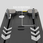 Close-up of a pilates board with overlaid white lines and the text 'BUILT IN RESISTANCE' pointing to a small yellow resistance pad near the center console area.