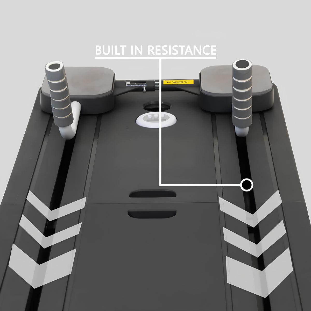 Close-up of a pilates board with overlaid white lines and the text 'BUILT IN RESISTANCE' pointing to a small yellow resistance pad near the center console area.