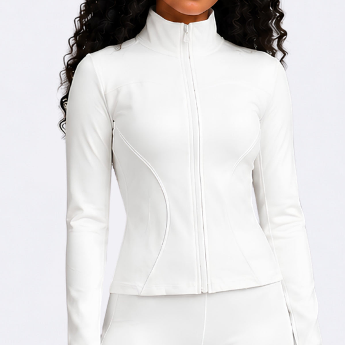 A woman wearing a fitted white long-sleeve athletic jacket with a high mock neck and front zipper, shown against a plain light background.